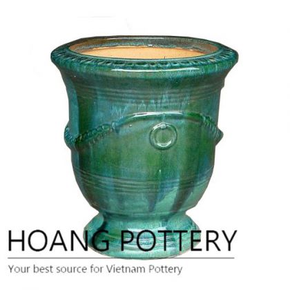 Dark green ceramic cup planter