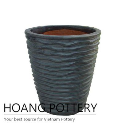 Matt black wave round ceramic planter